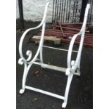 A Victorian wrought iron garden seat frame of scroll design