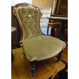 A 19th Century carved and incised walnut framed spoon back nursing chair with green velour