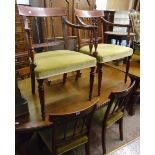 A set of eight late Regency style mahogany and strung dining chairs with green upholstered seats,