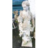 A 4' concrete garden statue of a classical maiden holding bunches of grapes
