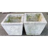 A pair of 14 1/2" concrete garden planters of square tapered design with Prince of Wales feathers