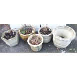 Three concrete garden planters of varying design and size - sold with two pottery planters