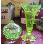 A uranium glass flared pedestal vase and lidded pot