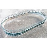 A 6' 1" 20th Century painted metal decorative garden border of oval design with arched wirework