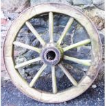 A 32" diameter old iron bound and wooden spoked cartwheel