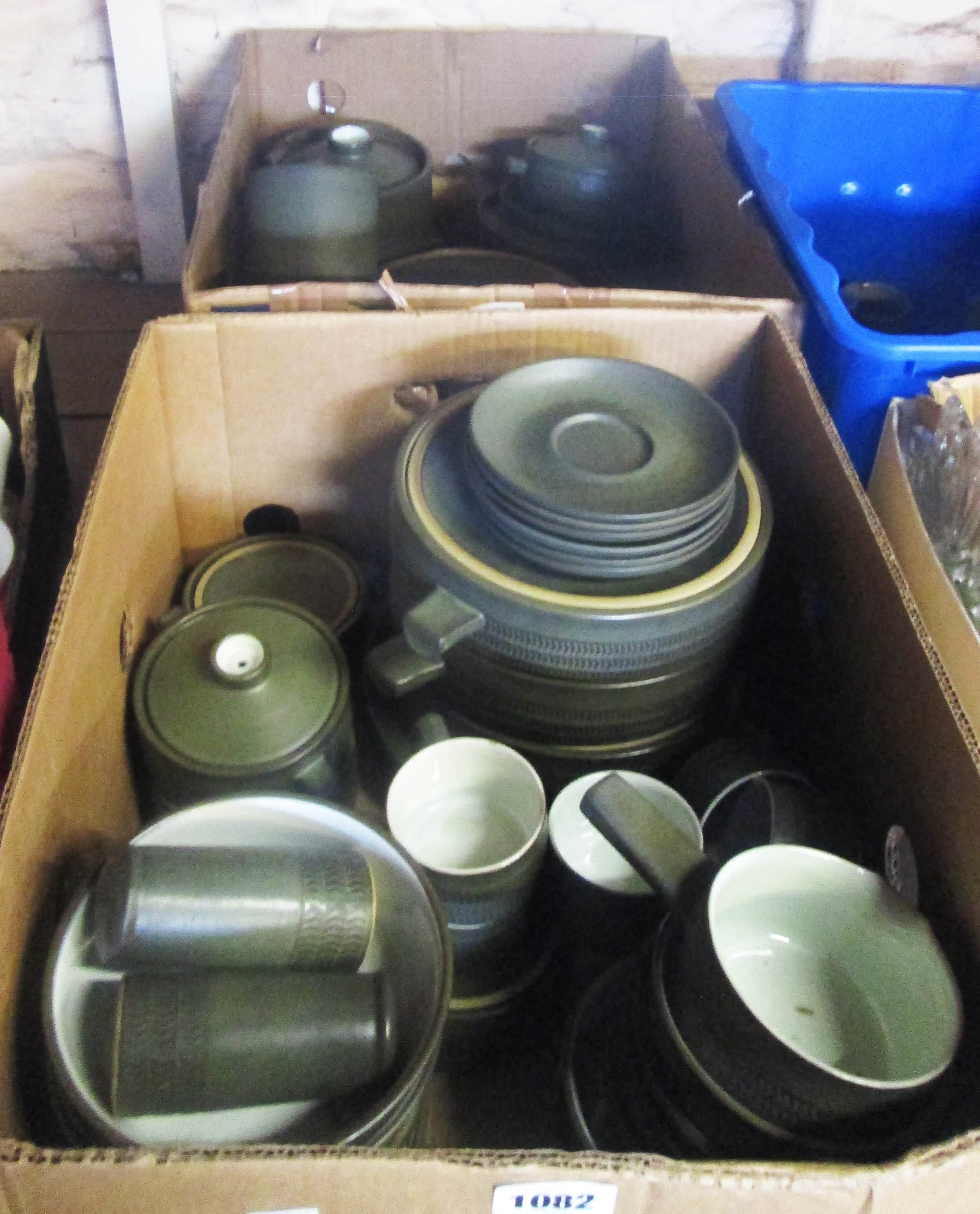 Two boxes containing a large collection of Denby Camelot pattern part tea and dinner service,