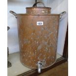 A 20" high old copper tea urn with flanking handles and tap