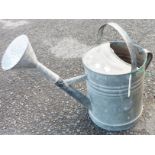 A vintage galvanised watering can