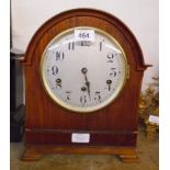 An early 20th Century mahogany cased break dome top table clock with Arabic numerals to dial and