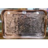 An 18 1/2" Arts and Crafts copper oblong tray with embossed dragons and acanthus scrolls