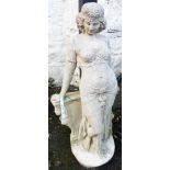 A 30" concrete garden statue in the style of an Egyptian revival female figure