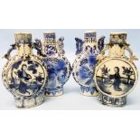 Two similar pairs of early 20th Century blue and white moon vases - 6" and 6 1/2" high respectively