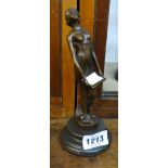 An 8" bronzed model of a lady with a tray, set on a socle base