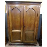 A 5' 19th Century French walnut armoire with moulded cornice and part fitted interior enclosed by