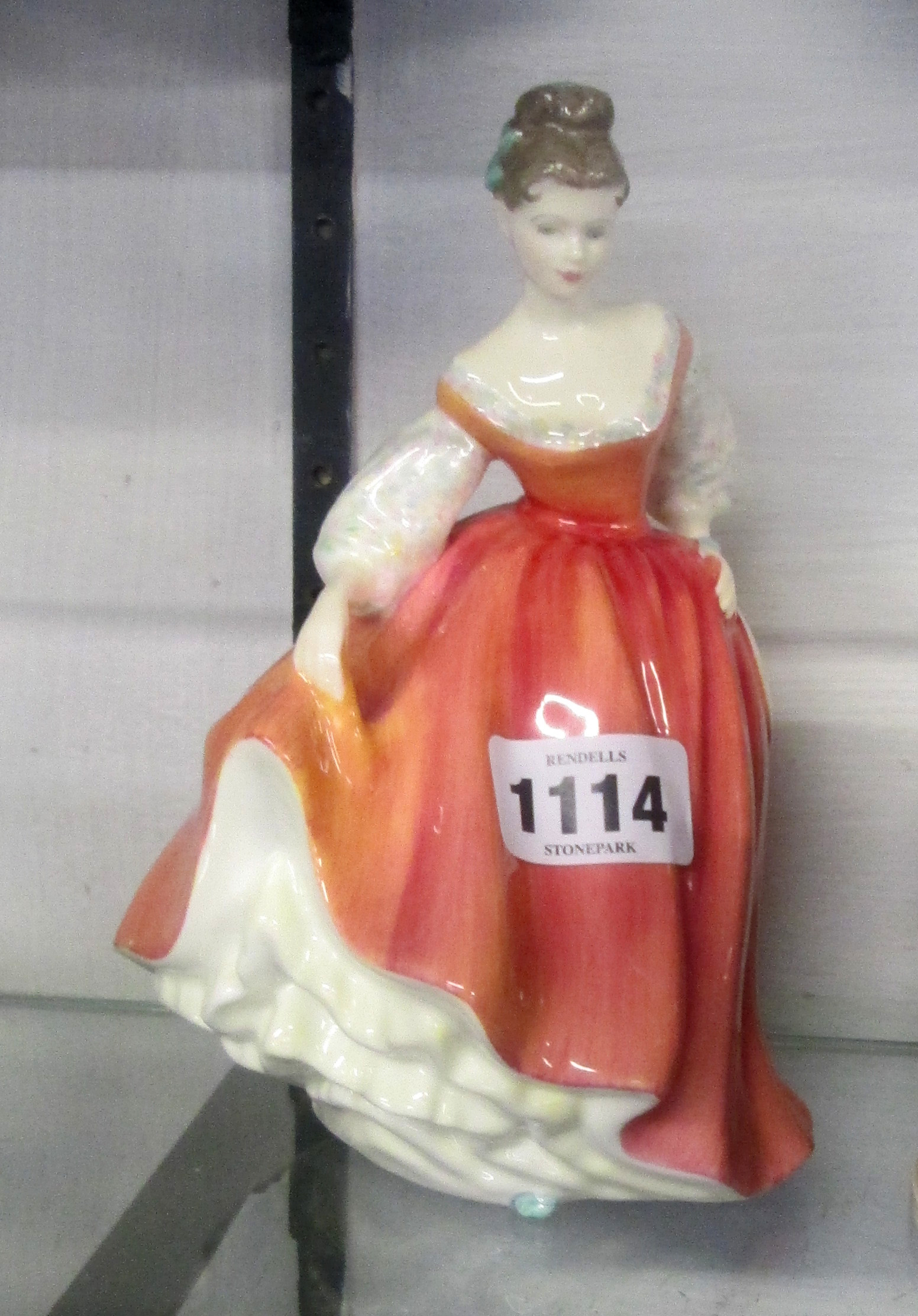 A Royal Doulton "Fair Lady" figurine HN 2835 (coral pink)