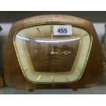 A mid 20th Century retro design walnut cased mantel clock with Smiths floating balance eight day