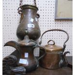 A Middle Eastern coffee pot with embossed decoration and a small lidded pan with swing handle - sold