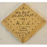 An early 20th Century Second Boer War period hardtack biscuit with inscription, "A Merry Christmas