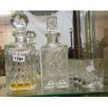 Two cut glass spirit decanters - sold with three cut glass tumblers