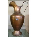 A 24" modern Turkish copper jug with hammered decoration