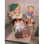 Two Goebel items comprising a 1950's Edelweiss boy and a girl pepper pot (Full Bee) - sold with a