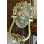 A heavy cast brass lion mask pattern door knocker and boss