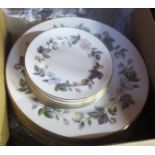 A box containing Royal Worcester June Garland pattern plates, comprising six each dinner and tea