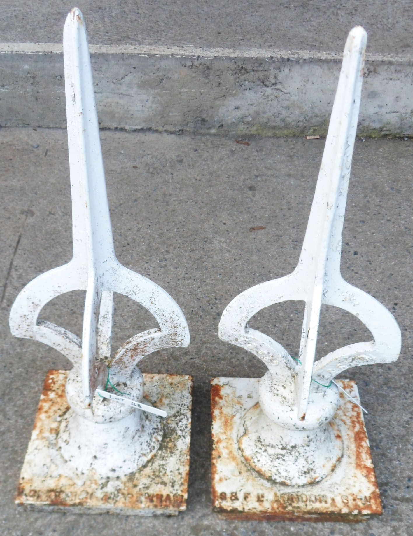 Two painted cast iron London and south west region railway signal finials - one London and