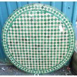 A 3' 4" diameter Spanish circular concrete exterior table top with checkerboard tile decoration