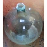 A large moulded glass carboy