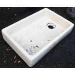 A 24" cream glazed Butler's sink