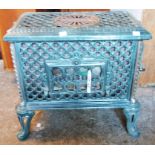 A 23" French Godin green enamelled cast iron Chaufette wood burner, set on cast cabriole legs - with