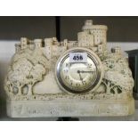 A 12 1/2" cast plaster cased mantel timepiece in the form of Windsor castle, "1910 Time Well Spent