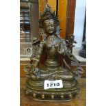 A bronzed model of the Bodhisattva Tara in lotus position, sat on a single lotus base