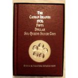 A boxed and cased 1976 Cayman Islands Fifty Dollar silver Six Queens coin