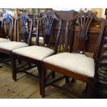 A set of four antique mahogany framed Hepplewhite style dining chairs with decorative wheatear