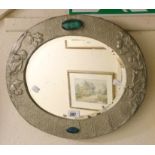 A 17 3/4" early 20th Century embossed pewter framed and enamelled cabochon set bevelled oval wall