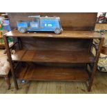 A 3' 6" antique mahogany three shelf open bookcase, set on square supports