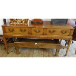 A 5' 3" 19th Century mahogany and strung sideboard with fitted cutlery drawer and two further frieze