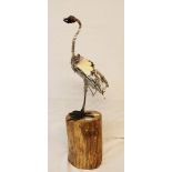 A 21" overall scrap metal bird sculpture set on a log by Richard Dawson Hewitt - signed to base