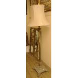 A Corinthian column brass telescopic standard lamp on stepped base and claw feet, with shade