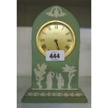 A Wedgwood green jasperware cased mitre shaped timepiece with gilt dial marked Baronet of London and