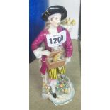 A 7 1/2" 19th Century Samson hard paste figure of a young rabbit catcher stood on a Rococo style