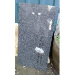 A piece of 29 3/4" X 15 3/4" polished granite with rounded corners - drill hole
