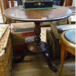 A 30" diameter Victorian style stained oak pedestal table, set on turned pillar and circular base