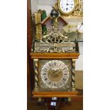 A 20th Century ornate gilt metal mounted polished wood cased Dutch Zandam style wall clock with