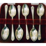 A cased set of six Walker & Hall silver teaspoons with crossed golf club and ball motif to terminals