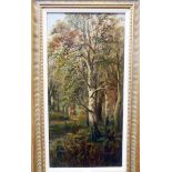 In the manner of William Widgery: a gilt framed oil on canvas of a figure carrying firewood on a