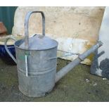 A vintage galvanised 2 gallon watering can