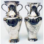 A 7 1/4" Oriental white metal baluster vase with flanking loop handles and engraved group of carp